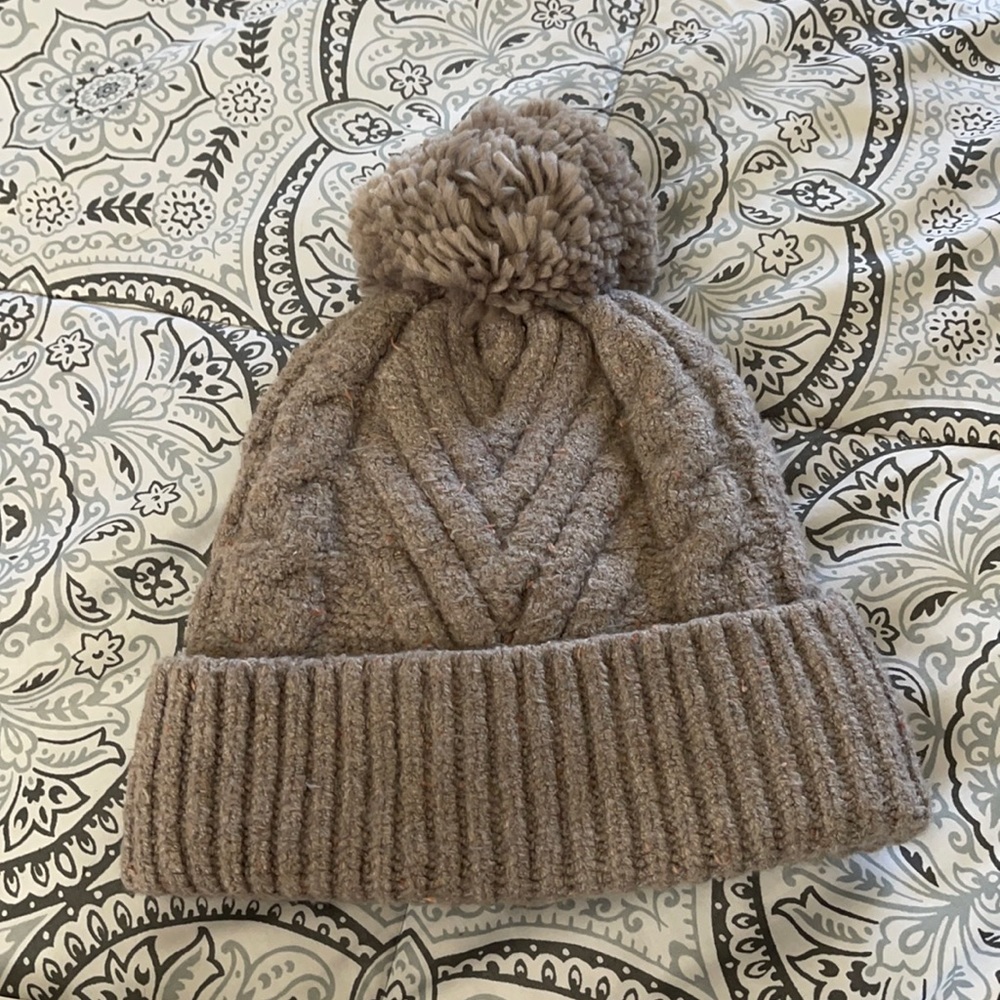 Taupe beanie with puff ball